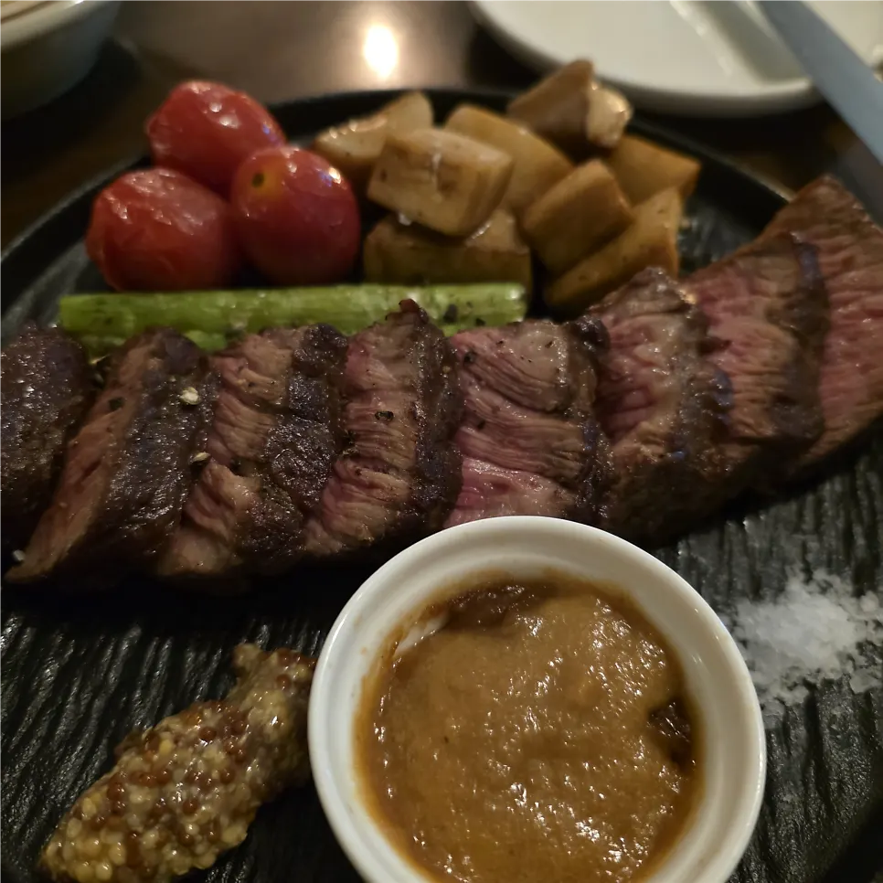 Beef chuck flap steak platter served with roasted vegetables