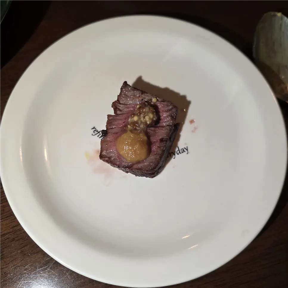 Cross-section of the chuck flap steak with accompanying sauces