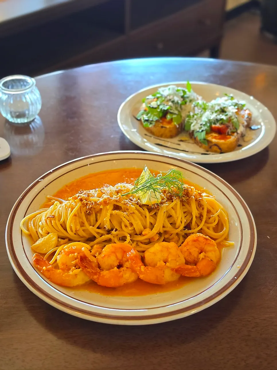 Bisque rosé pasta topped with shrimp
