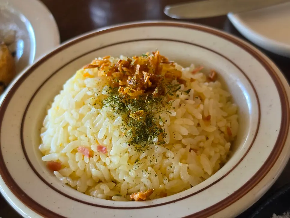 Garlic rice topped with garlic flakes