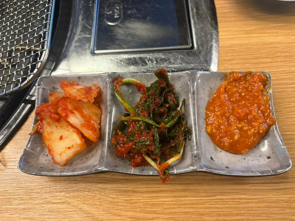 Green onion kimchi, cabbage kimchi, and ssamjang served as basic sides
