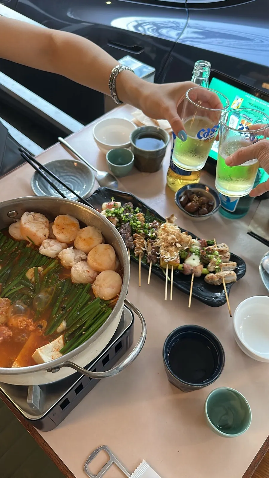 Skewers and motsunabe at the outdoor table