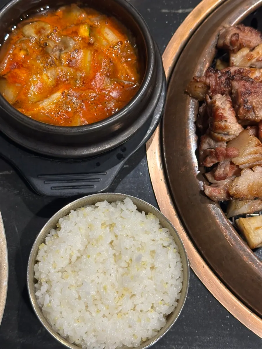Black pork grilled by a staff member