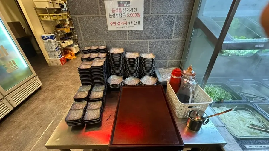 Self-serve bar with lettuce wraps and side dishes