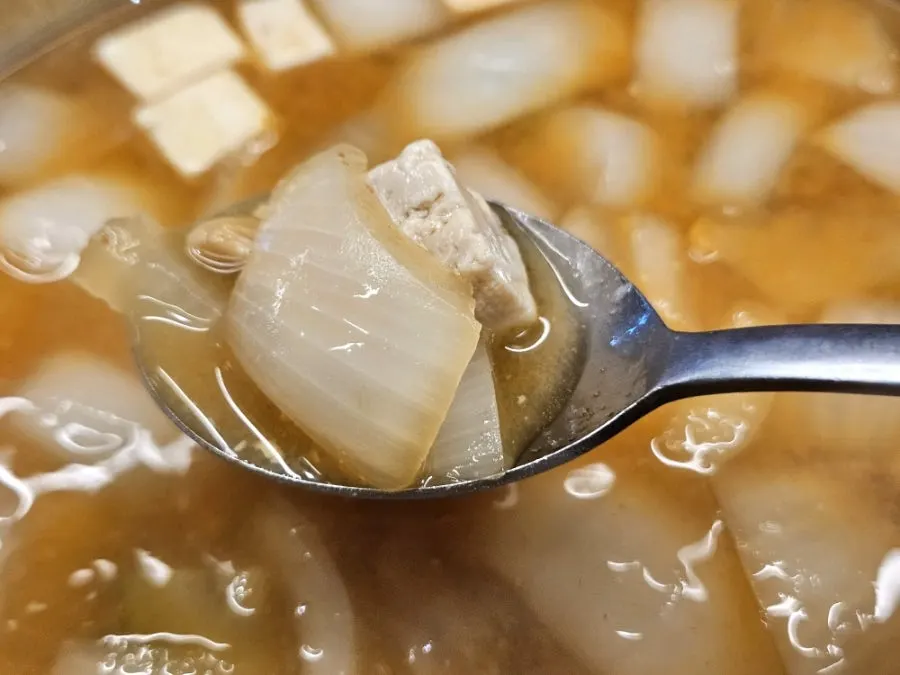 A spoonful of doenjang jjigae broth