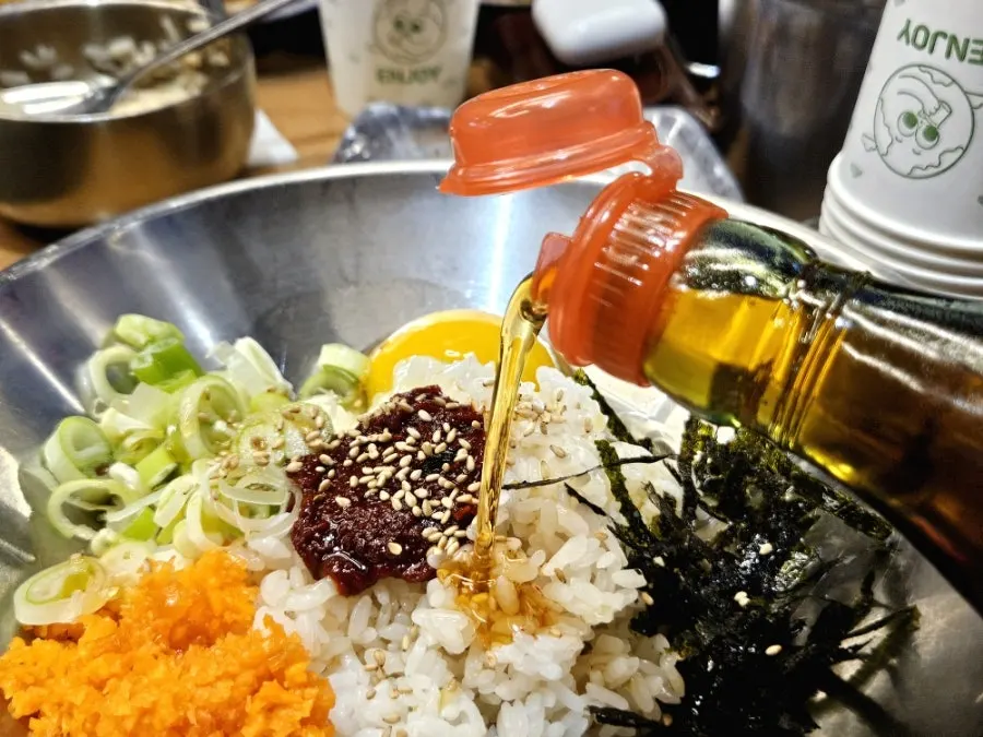 Fried rice with self-bar sauce and seaweed flakes drizzled on top