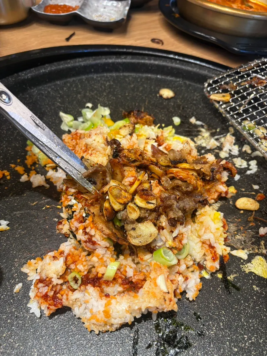 Self-made fried rice with seaweed flakes, garlic, and egg