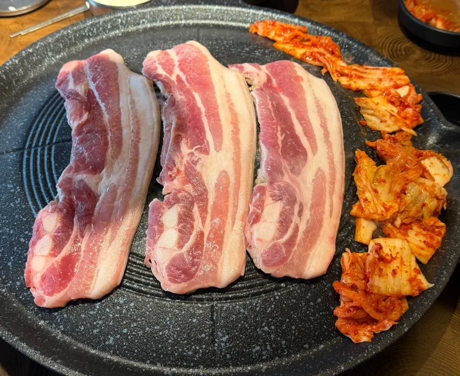 Pork belly table setting at Yuksam Maeul Nonhyeon Station Main Branch