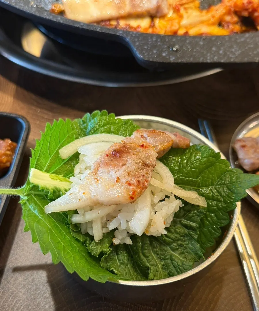 A large pork belly lettuce wrap