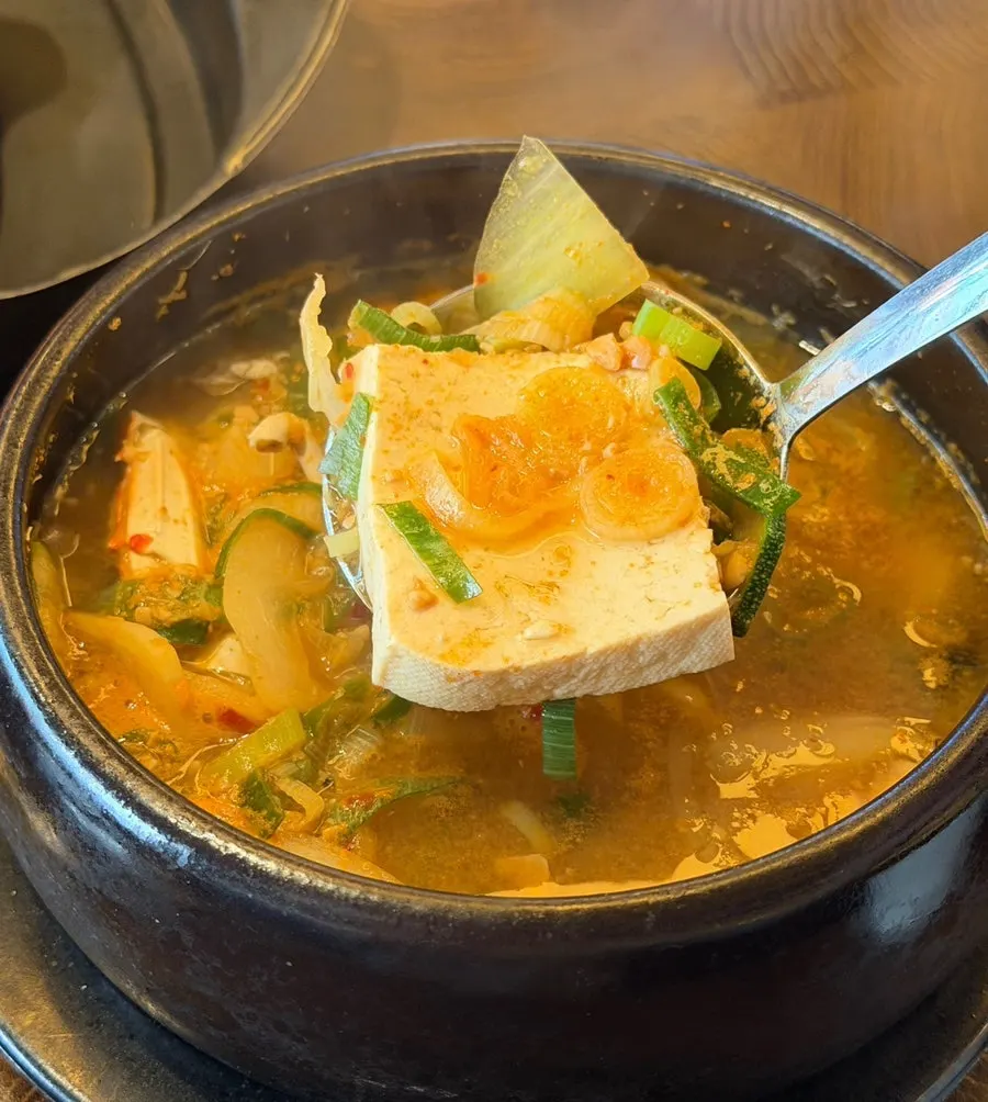 Stone pot of complimentary mussel and seafood doenjang stew