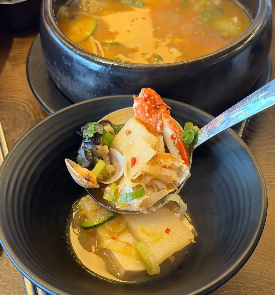 Doenjang stew with tofu, zucchini, and seafood