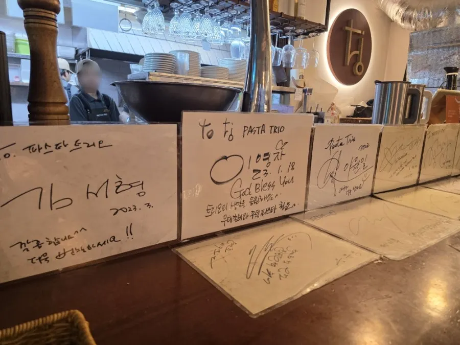 Celebrity autographs displayed in the restaurant