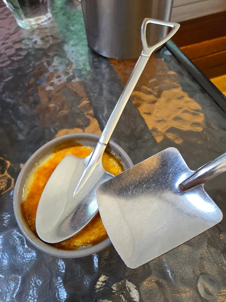 A large spoonful scooped from the crème brûlée