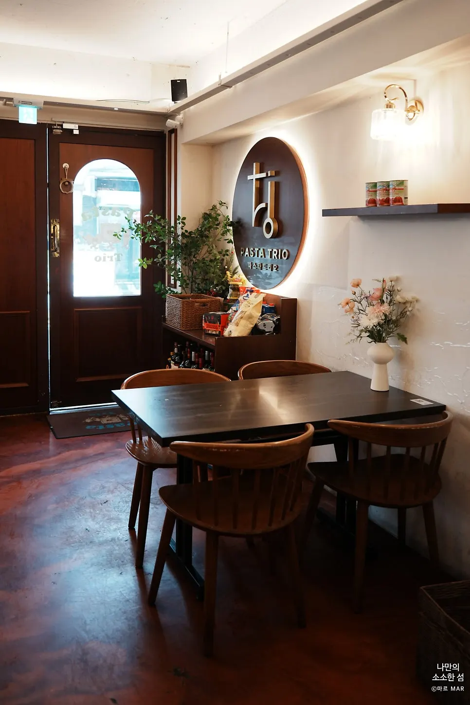 Wine and Italian ingredients displayed on entrance shelves