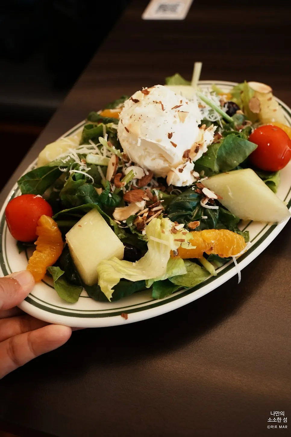 Seasonal fruit salad with melon and house-made ricotta cheese
