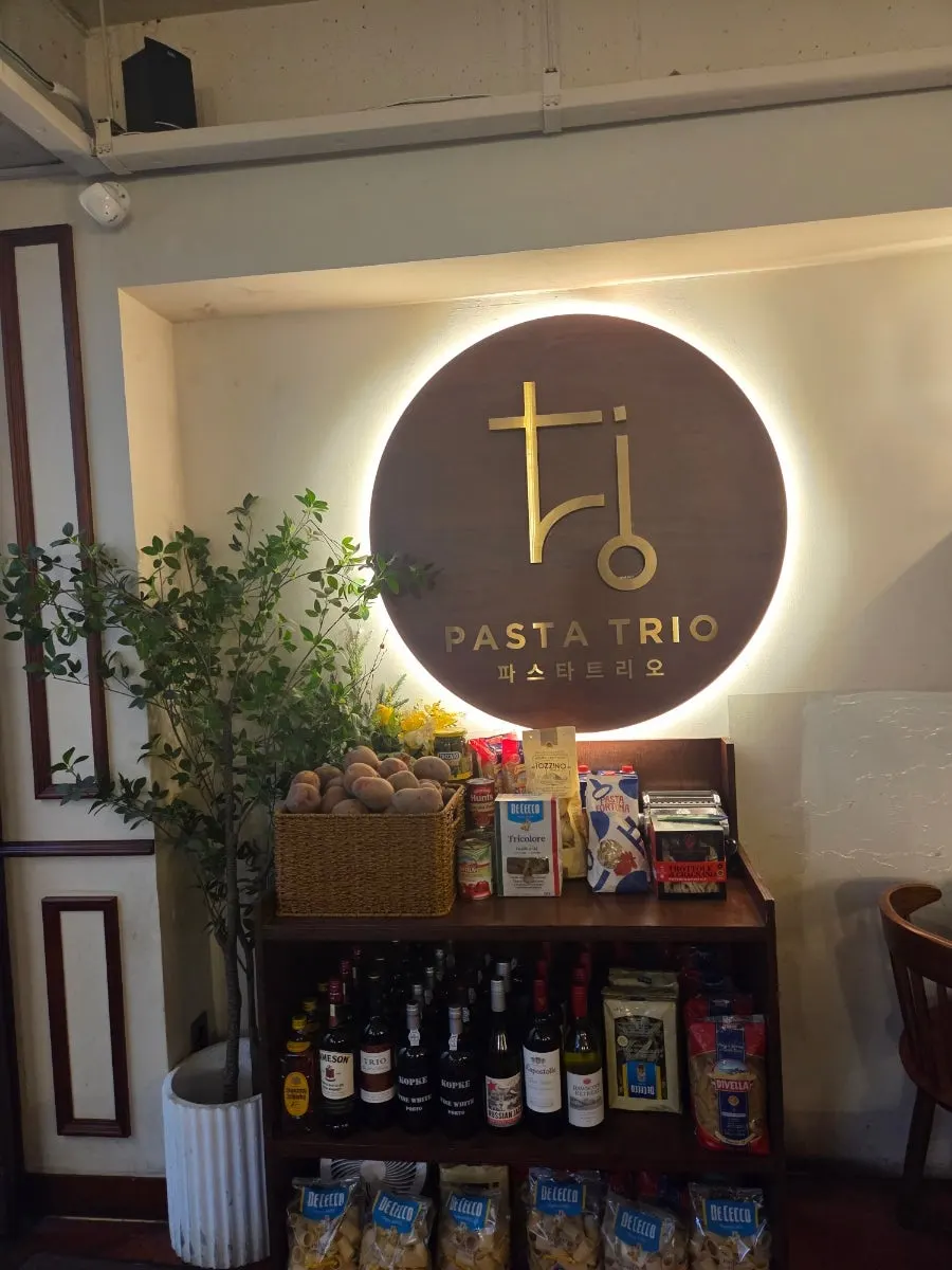 View of Pasta Trio blending into the alley atmosphere