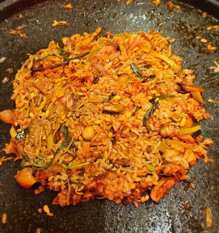Preparing fried rice with frozen pork belly fat