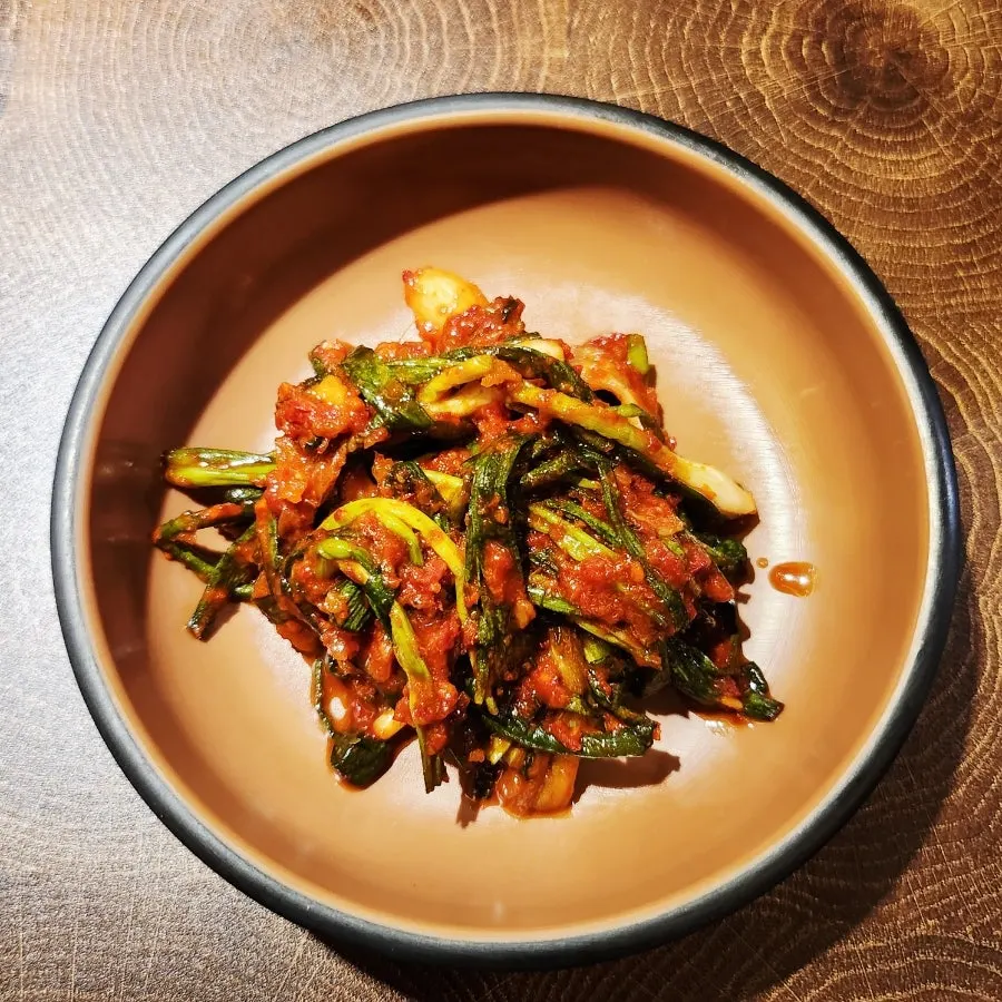 Green onion kimchi served with pork barbecue