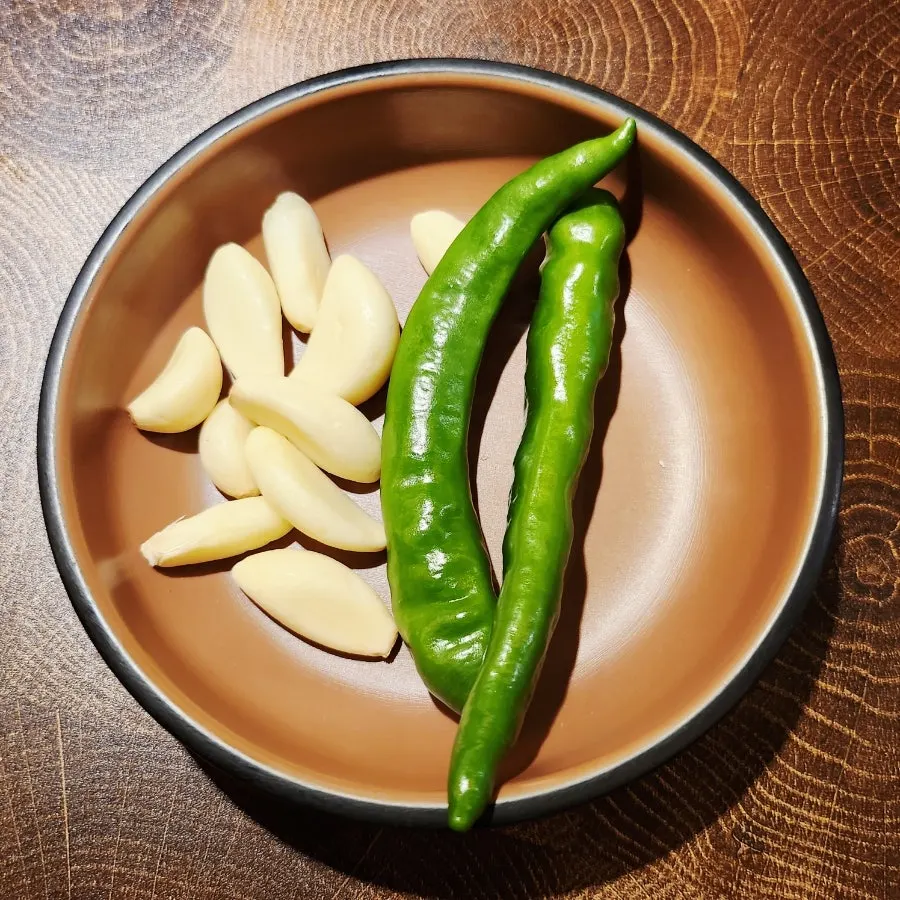 Garlic and chili peppers served with grilled meat