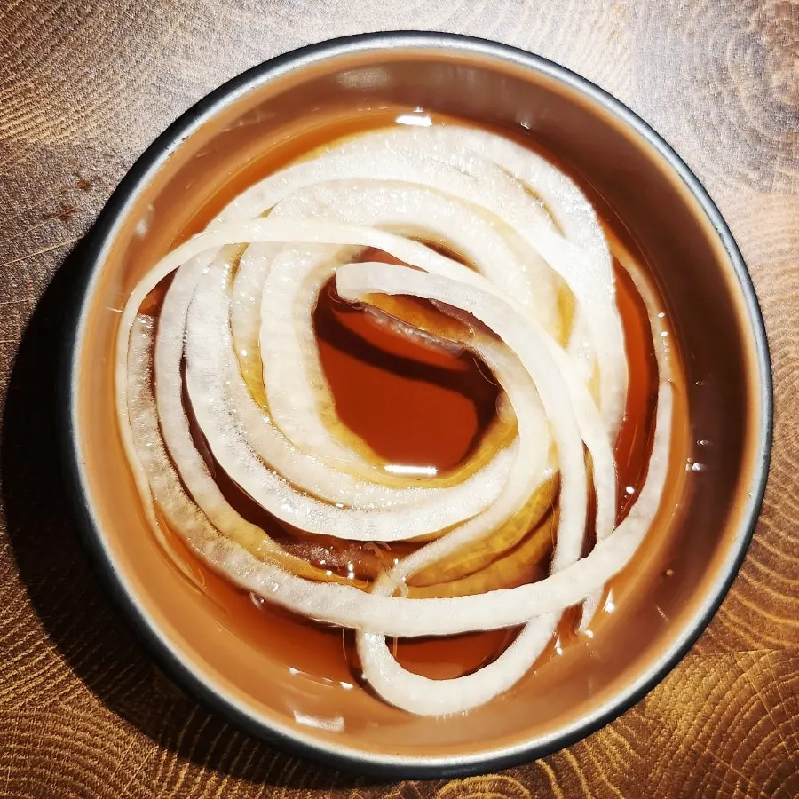 Onions and sesame sauce served with grilled meat