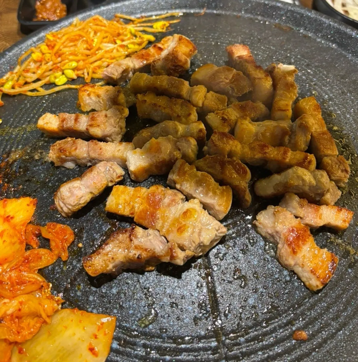 A golden-browned piece of thick-cut pork belly