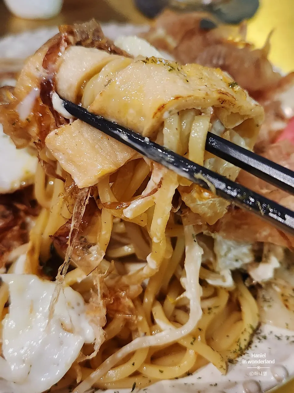 Plate of yakisoba topped with bonito flakes