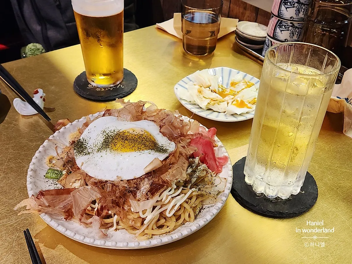 Yakisoba and beer set on the outdoor table