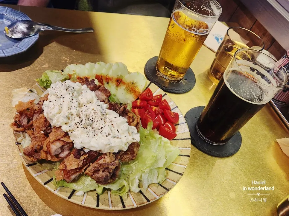 Chicken nanban served with cucumber, cherry tomatoes, and lettuce