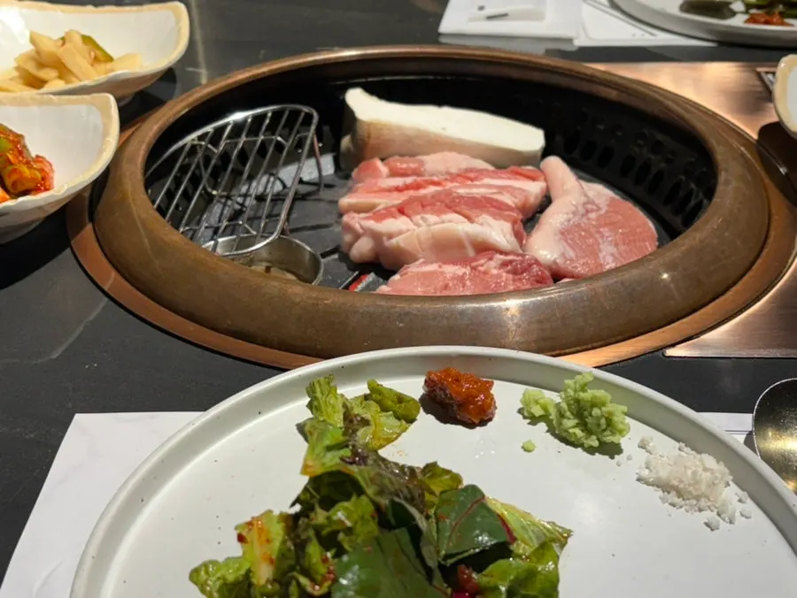 Table with side dishes and sauces set out
