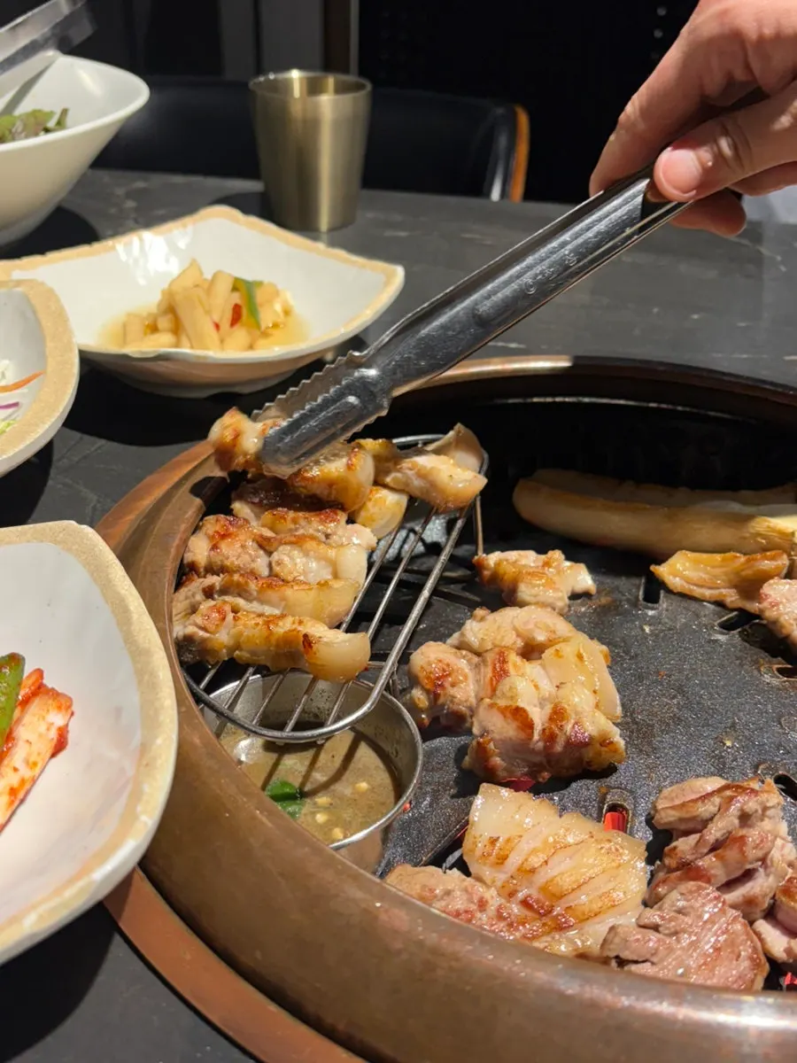 A piece of Jeju black pork dipped in salt