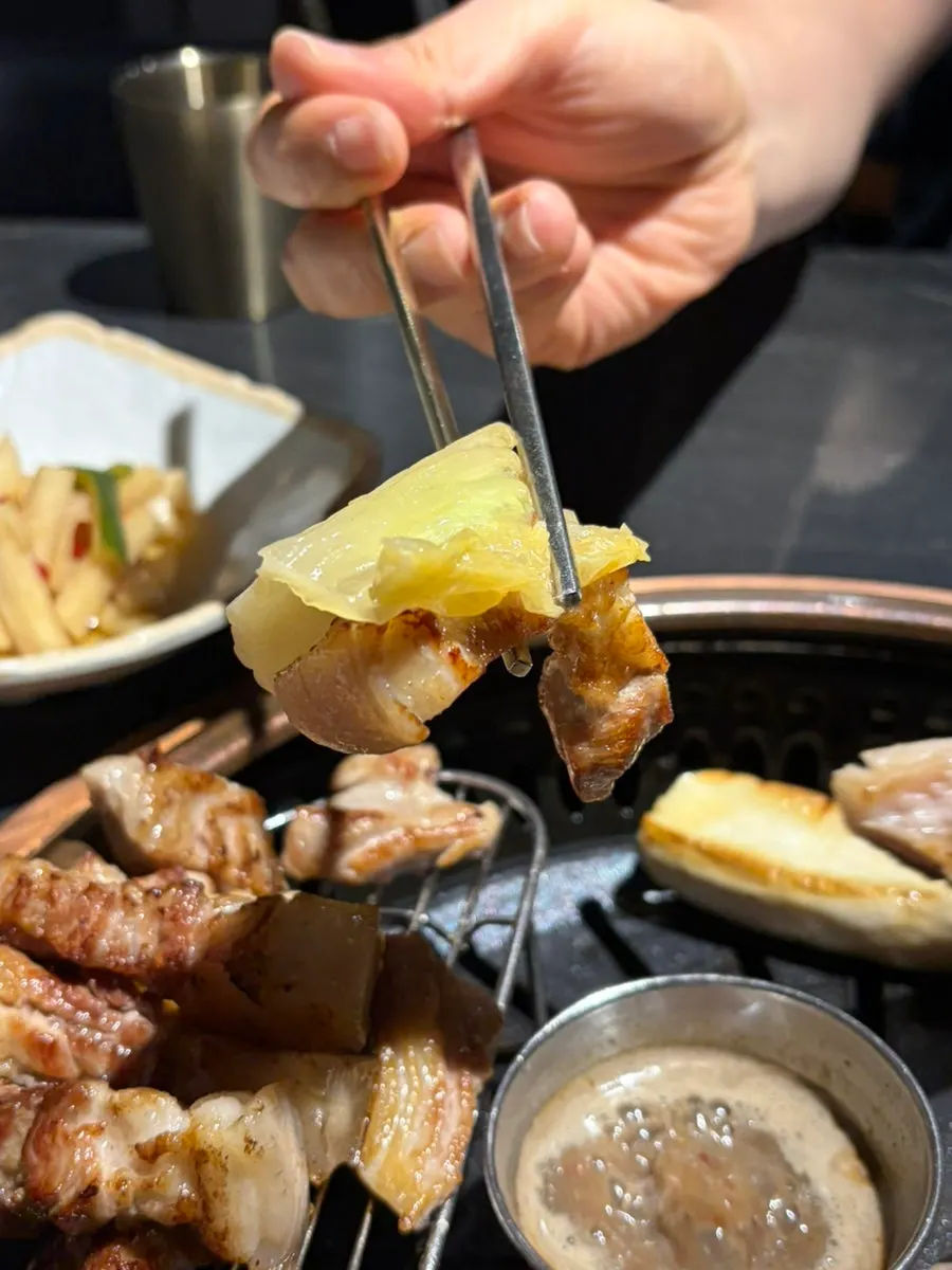 Table spread with baek-kimchi and grilled meat
