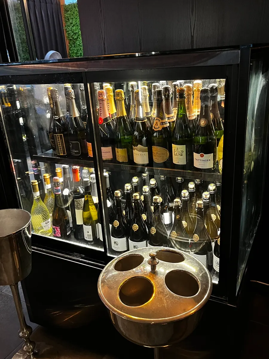 Wine, whiskey, and beer on display inside Luna Vine