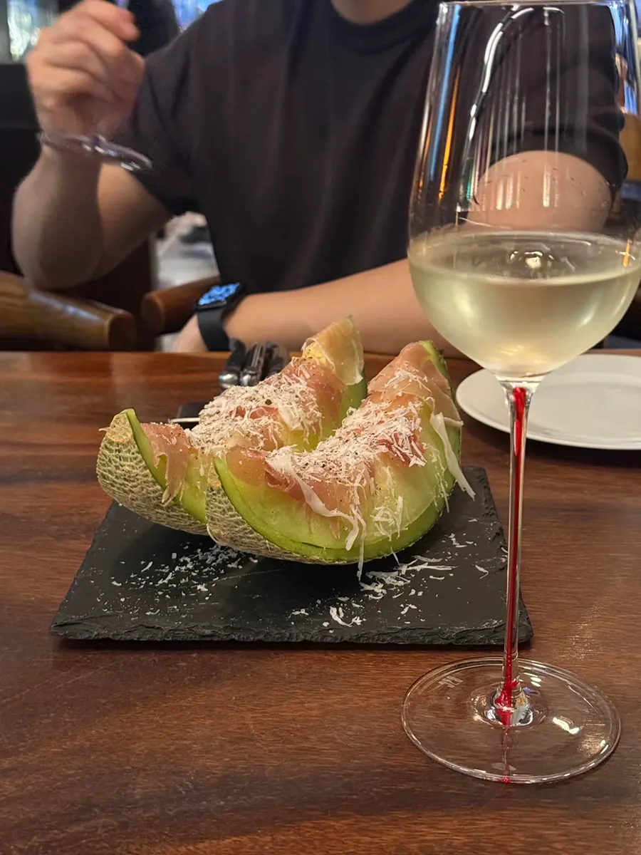 A plate of melon prosciutto