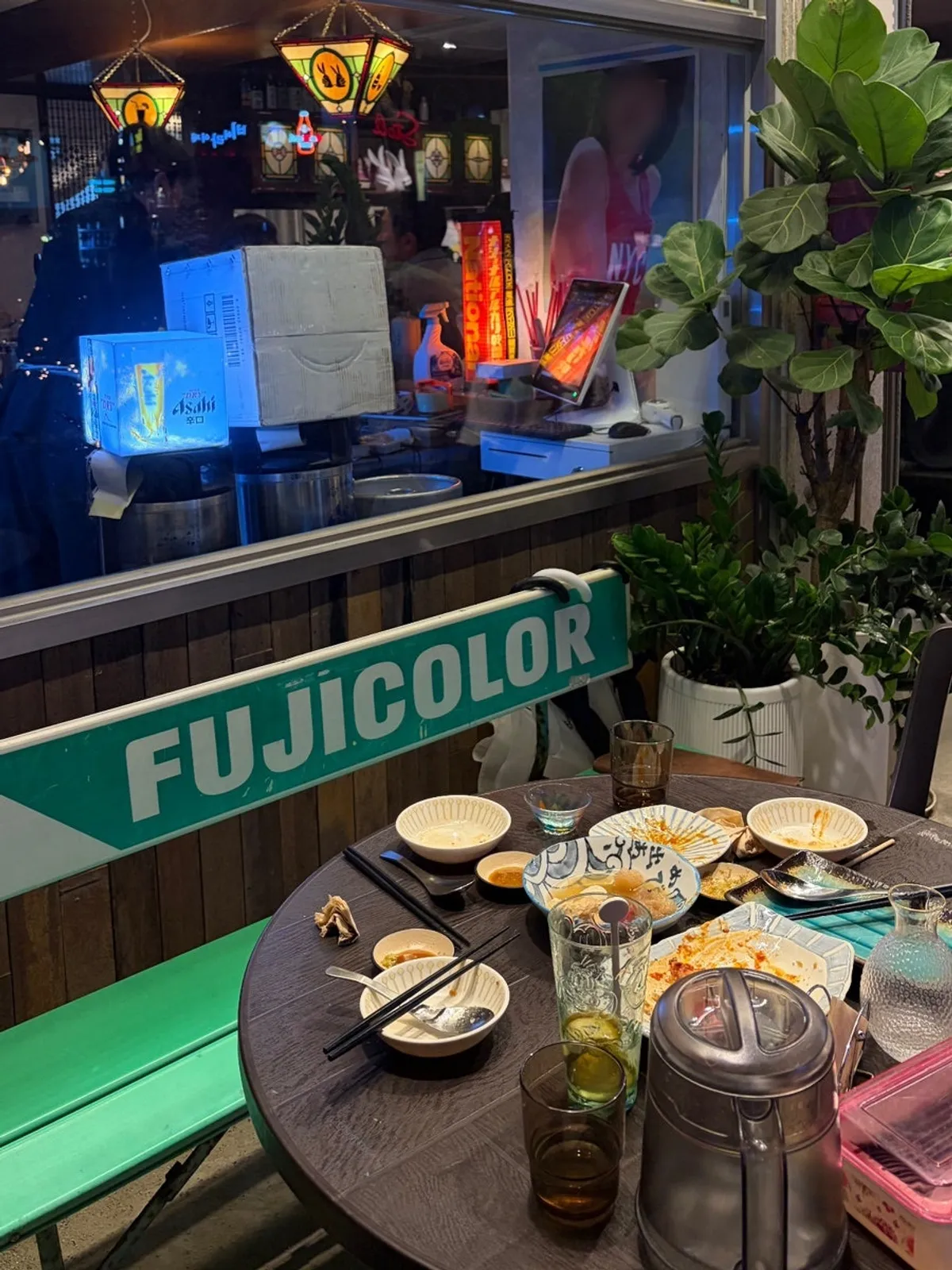 A tokkuri of sake and fish cake on the outdoor table