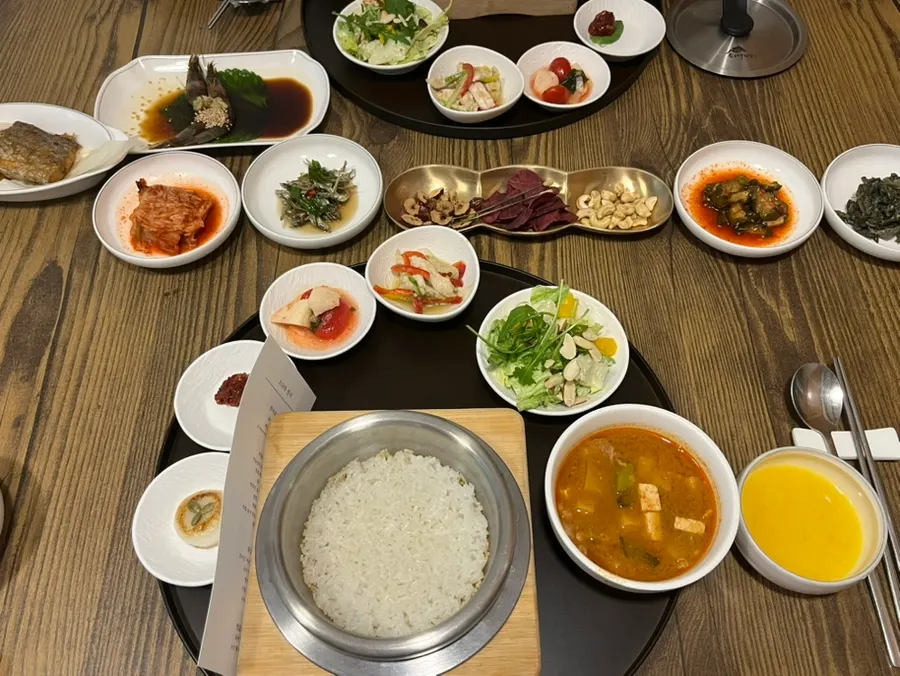 Table setting with grilled fish and marinated raw shrimp
