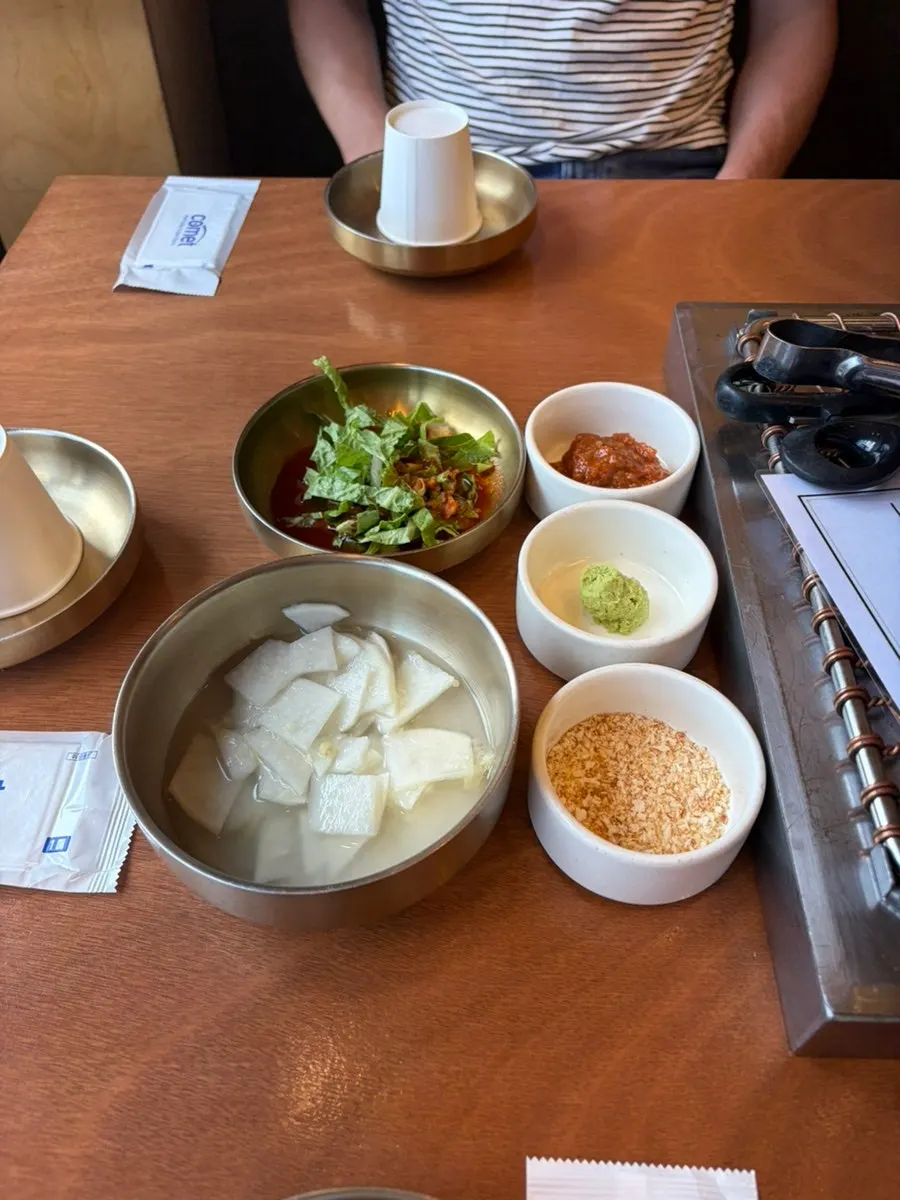 Basic table setting served alongside the black pork