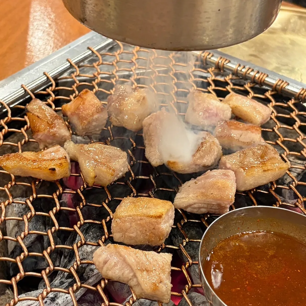 Signature photo of grilled black pork at Nopo Dwaeji Aewol