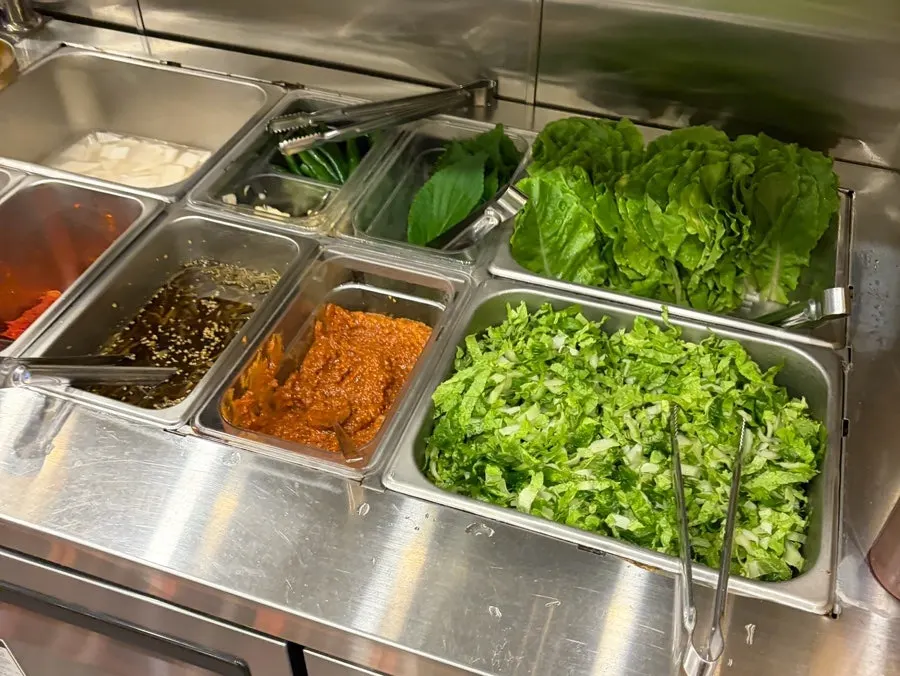 Self-serve bar with wrap vegetables and side dishes