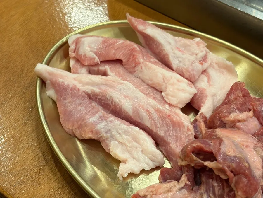 Close-up of densely marbled black pork hangjeongsal