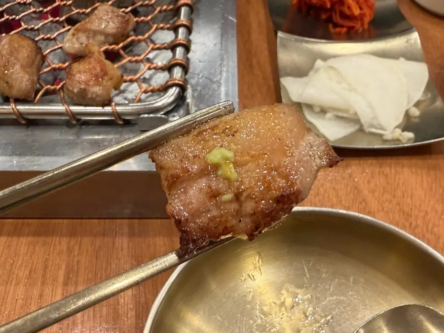 A piece of black pork with wasabi