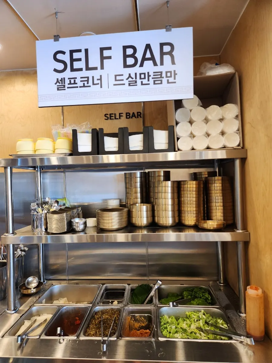 Self-serve bar with kimchi and lettuce wraps