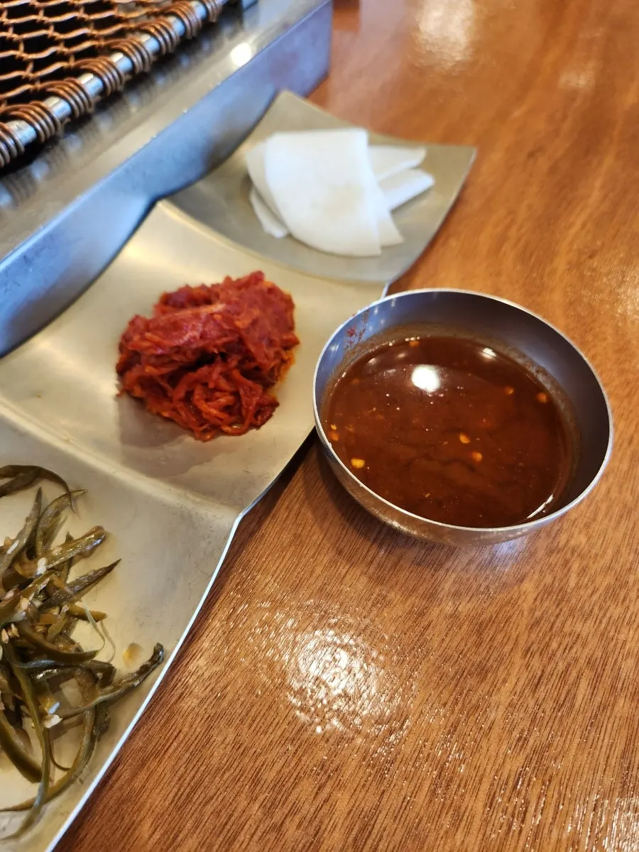 Grilled black pork dipped in salted anchovy sauce
