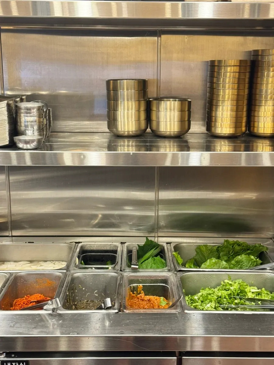 Self-serve bar with refillable side dishes at Nopo Dwaeji Aewol