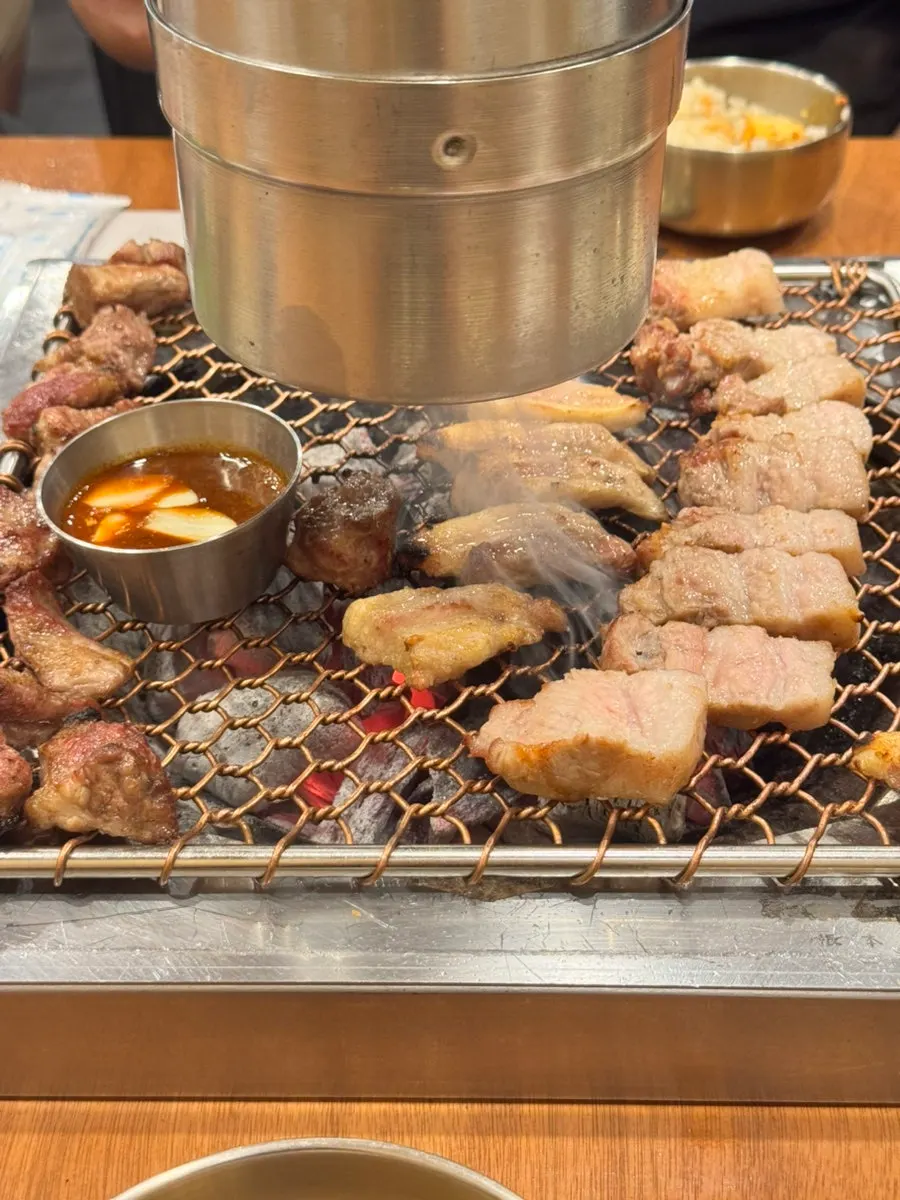 Black pork cooking quickly over the charcoal fire