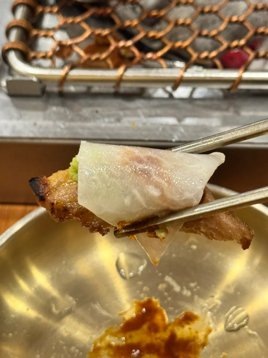Black pork wrapped in lettuce leaves