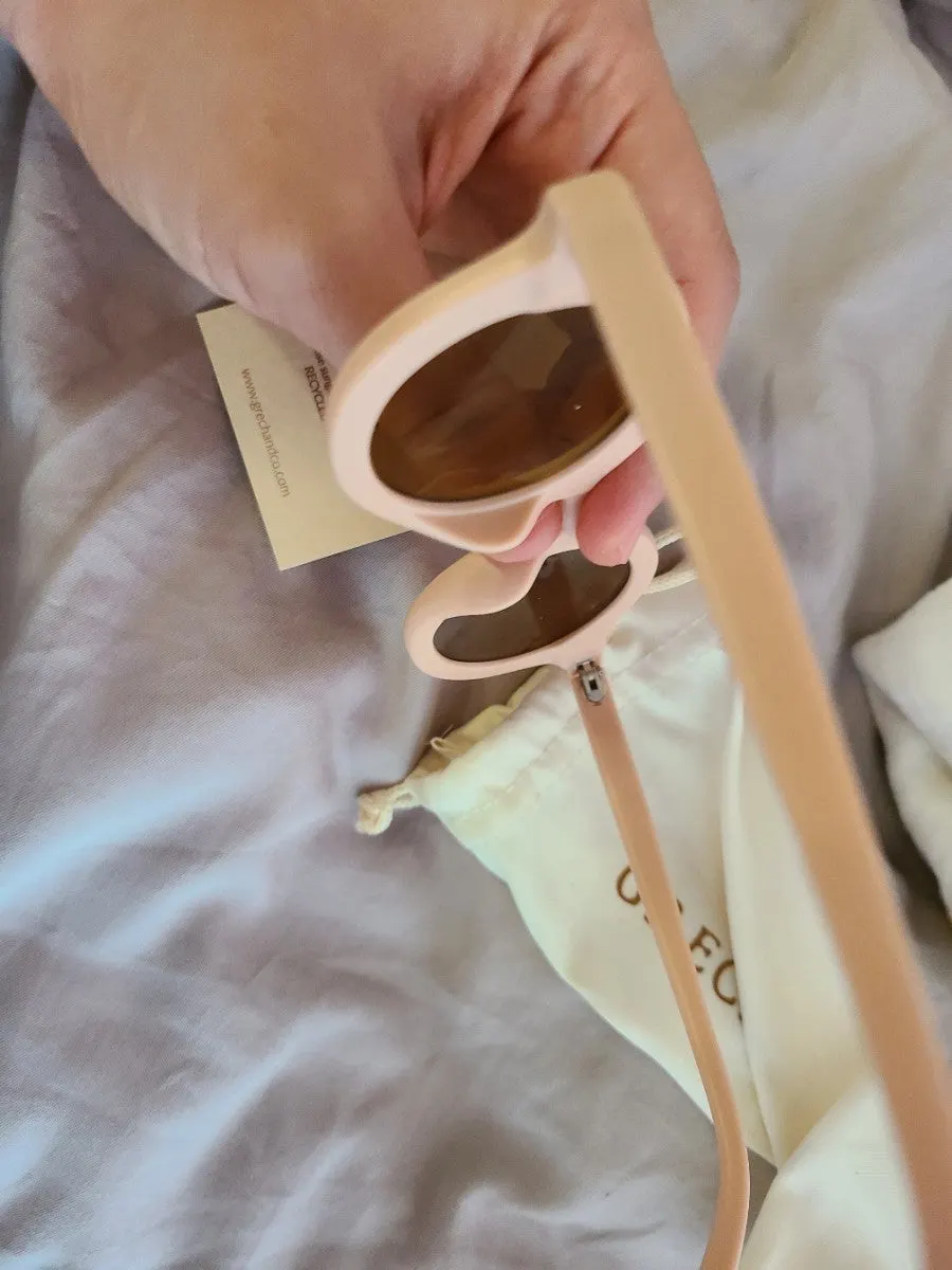 Child wearing Greg & Co children’s sunglasses