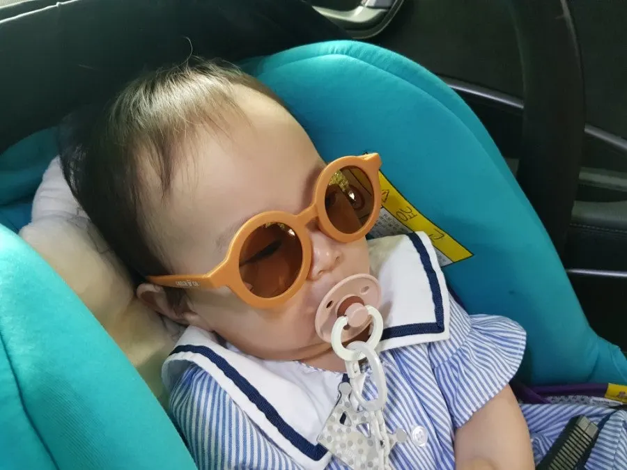 Child wearing kids sunglasses
