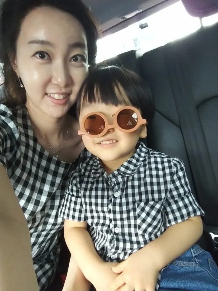 Mother and child having a sunglasses selfie session