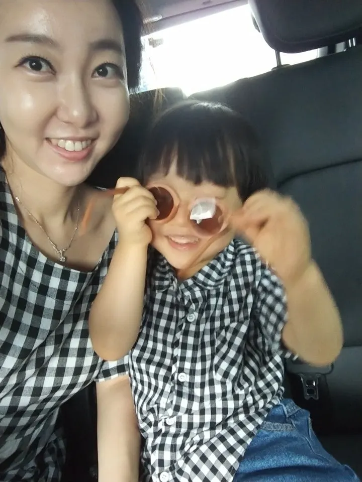 Child posing with sunglasses