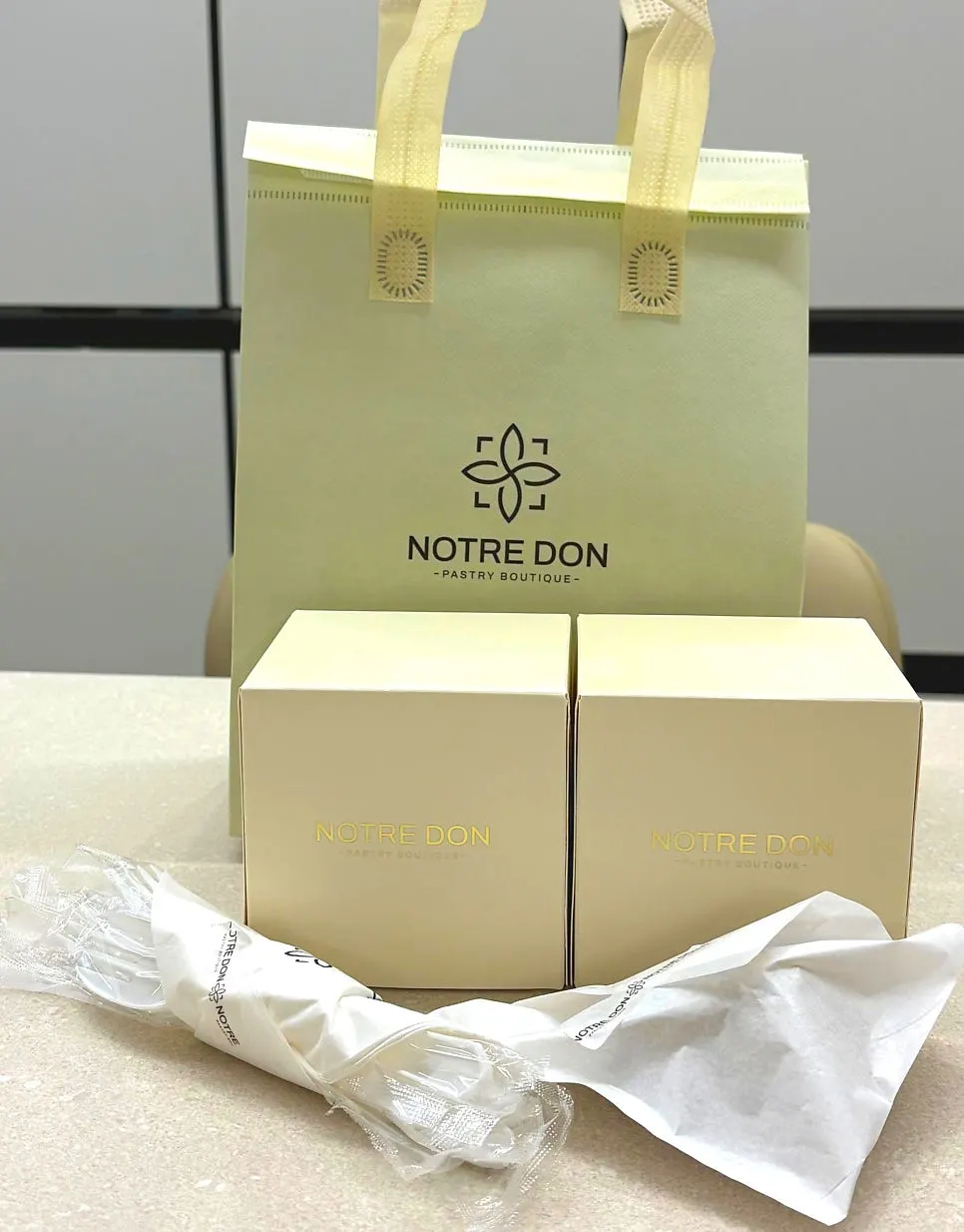 Boxed Notldun desserts packed for takeout